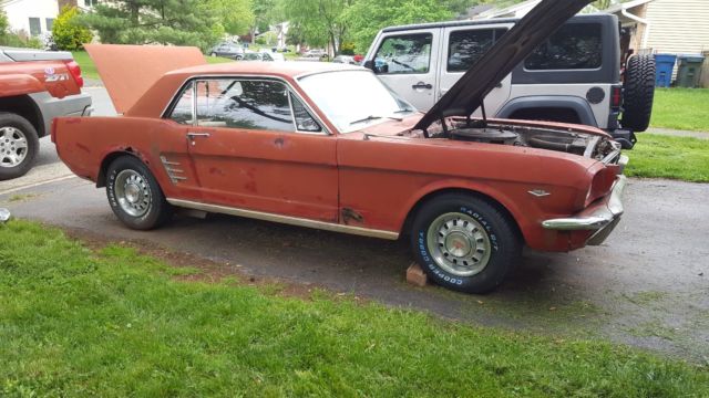 1966 red/black Ford Mustang Coupe