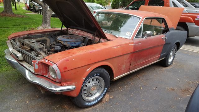 1966 red/black Ford Mustang Coupe