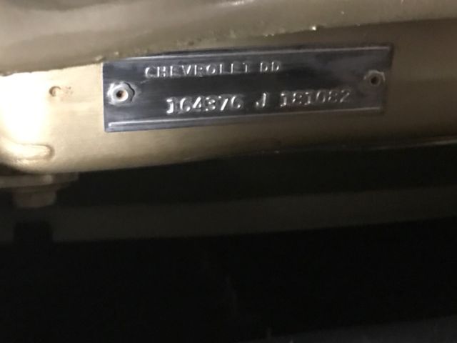 1966 gold Chevrolet Impala Coupe