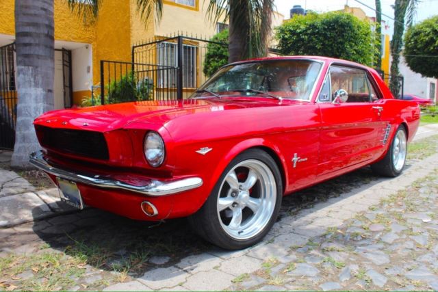 1966 red Ford Mustang Sedan