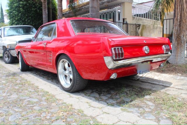 1966 red Ford Mustang Sedan