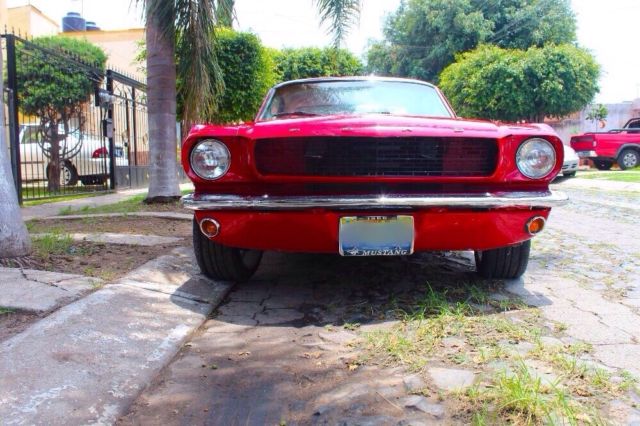 1966 red Ford Mustang Sedan