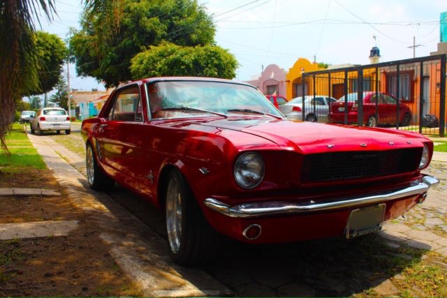 1966 red Ford Mustang Sedan