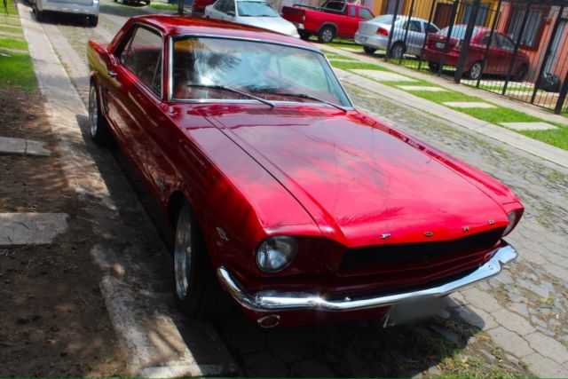 1966 red Ford Mustang Sedan