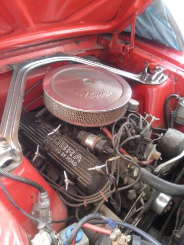 1966 red Ford Mustang Sedan