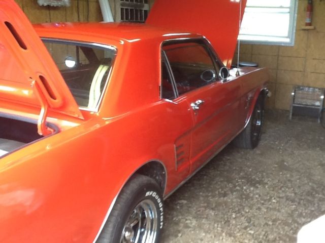 1966 signal flare red Ford Mustang coupe