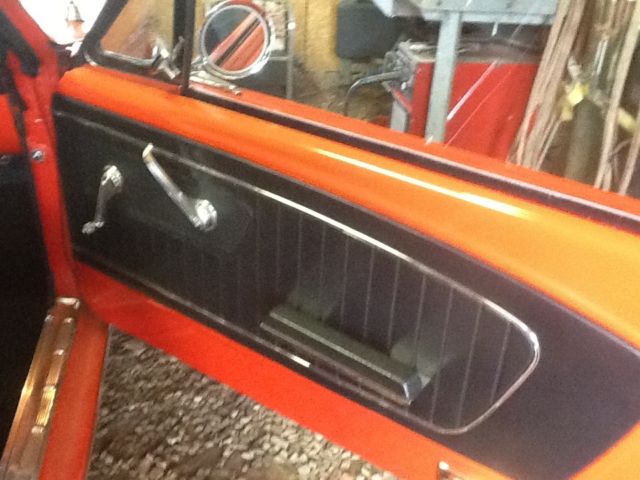 1966 signal flare red Ford Mustang coupe