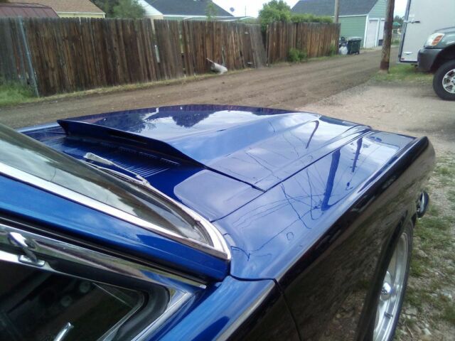 1966 Super jet black on bottom on bottom and impulse blue on top Ford Mustang Coupe