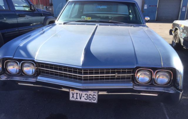 1966 Blue Oldsmobile Ninety-Eight Sedan