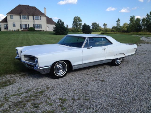 1966 white Pontiac Grand Prix Coupe