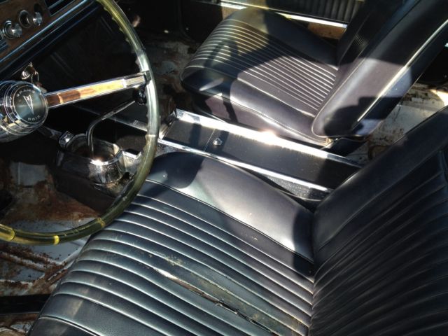 1966 white Pontiac Grand Prix Coupe