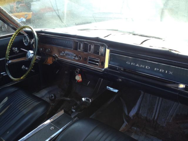 1966 white Pontiac Grand Prix Coupe