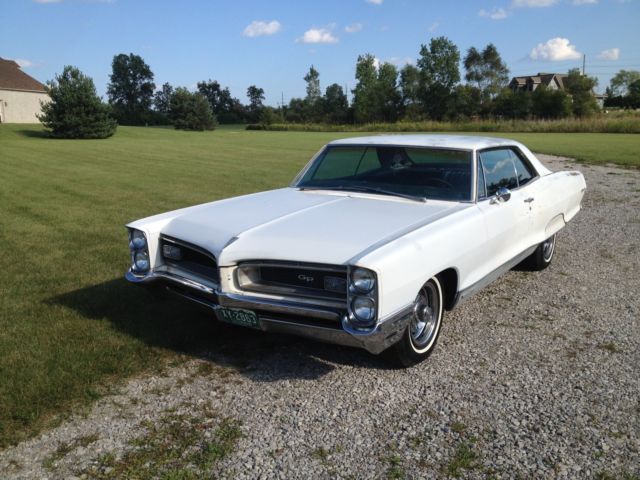 1966 white Pontiac Grand Prix Coupe