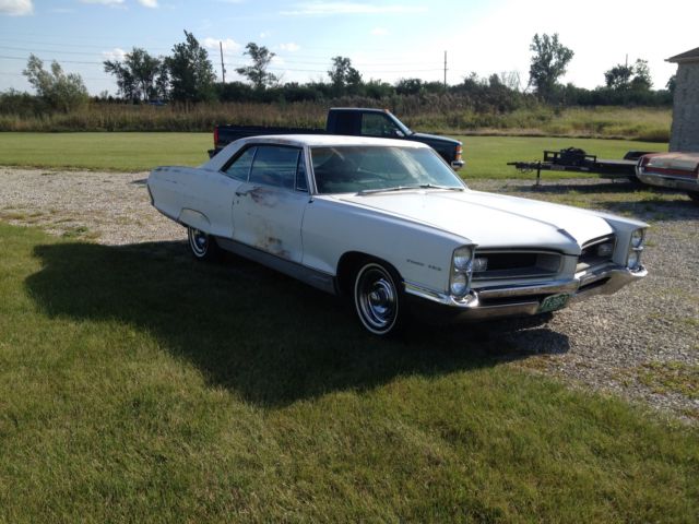 1966 white Pontiac Grand Prix Coupe