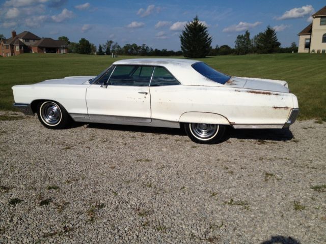 1966 white Pontiac Grand Prix Coupe