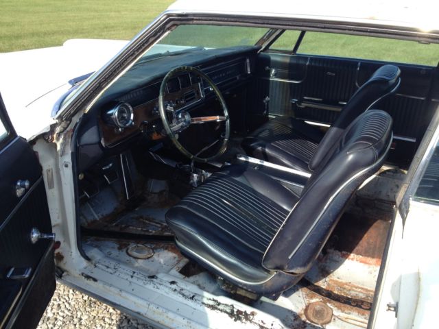 1966 white Pontiac Grand Prix Coupe