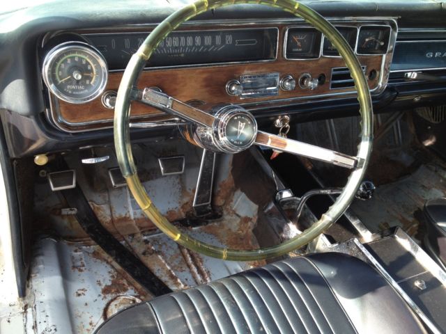 1966 white Pontiac Grand Prix Coupe