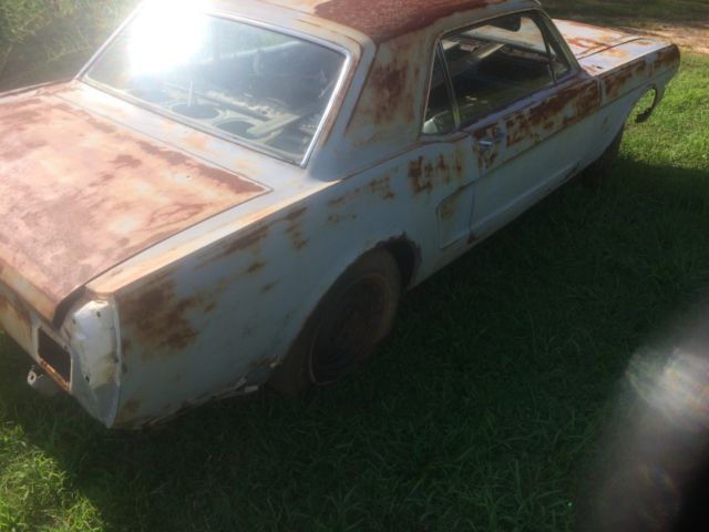 1966 Primer black and yellow Ford Mustang 2 door coupe