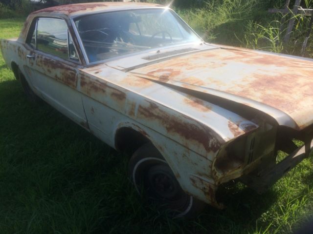 1966 Primer black and yellow Ford Mustang 2 door coupe
