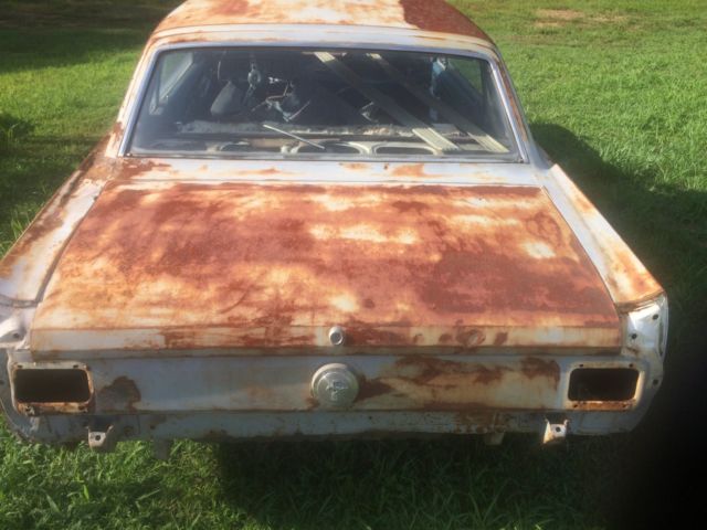 1966 Primer black and yellow Ford Mustang 2 door coupe