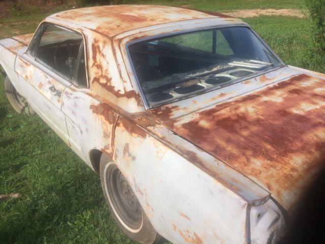 1966 Primer black and yellow Ford Mustang 2 door coupe