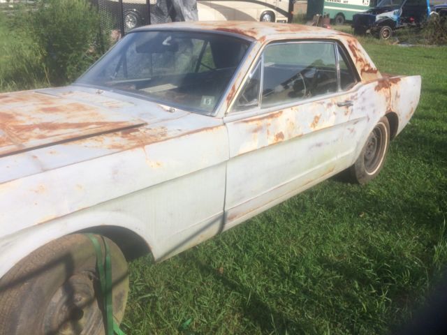 1966 Primer black and yellow Ford Mustang 2 door coupe