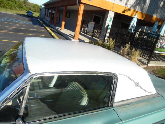 1966 green Ford Thunderbird