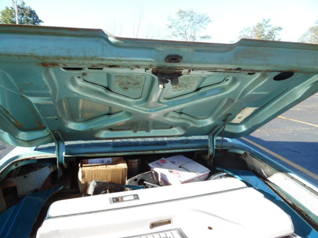 1966 green Ford Thunderbird