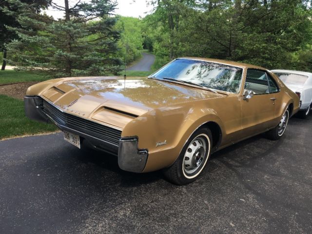 1966 Trumpet Gold Oldsmobile Toronado