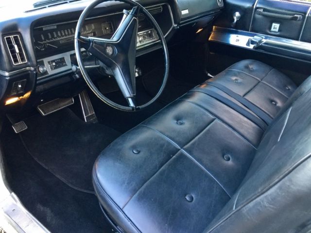 1967 White Cadillac DeVille Convertible