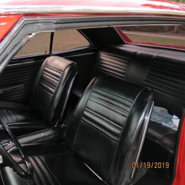 1967 red Chevrolet Chevelle Coupe