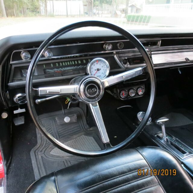 1967 red Chevrolet Chevelle Coupe