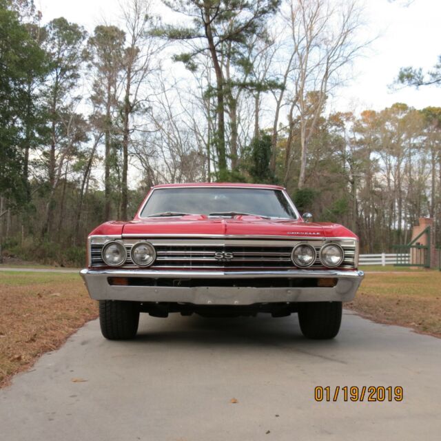 1967 red Chevrolet Chevelle Coupe