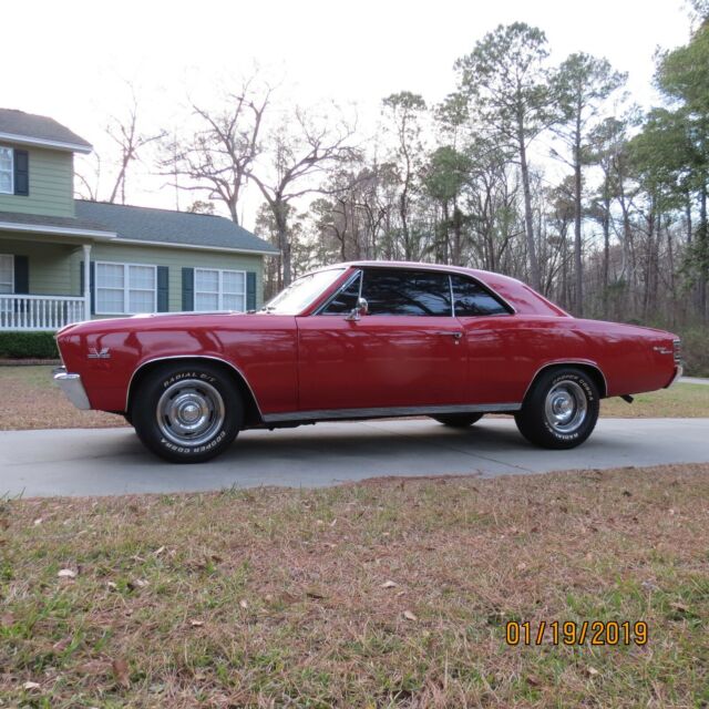 1967 red Chevrolet Chevelle Coupe