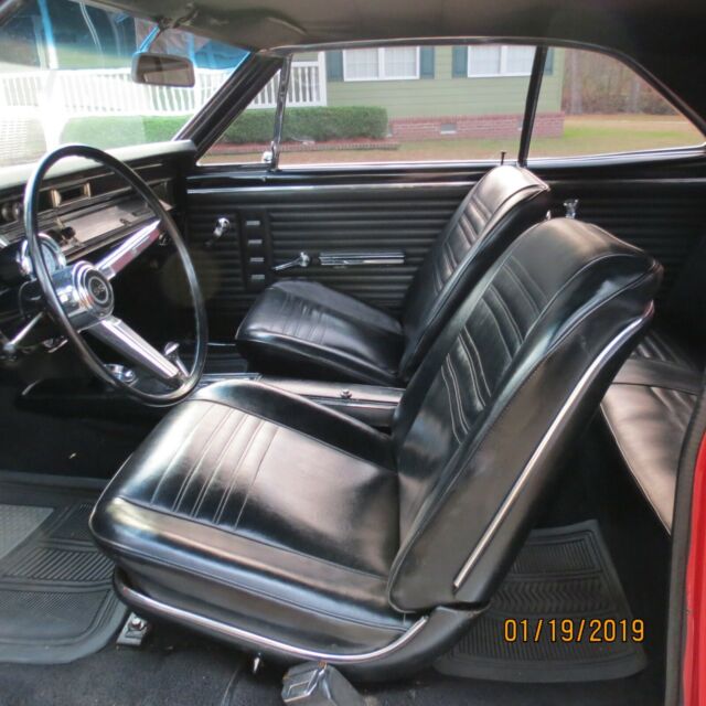1967 red Chevrolet Chevelle Coupe