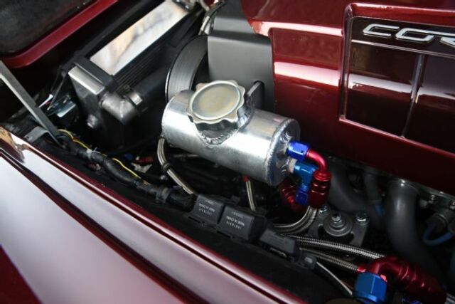 1967 maroon Chevrolet Corvette