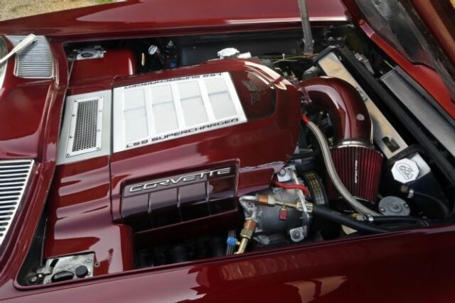 1967 maroon Chevrolet Corvette