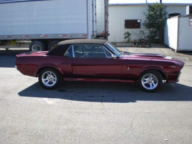 1967 maroon Ford Mustang Coupe