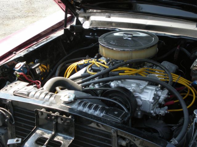 1967 maroon Ford Mustang Coupe