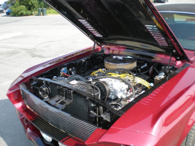 1967 maroon Ford Mustang Coupe