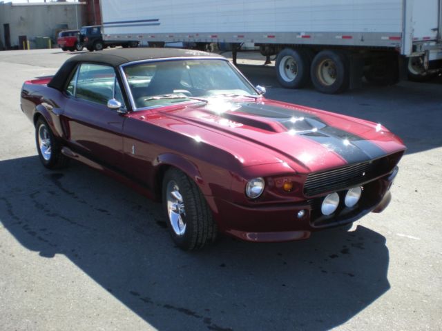 1967 maroon Ford Mustang Coupe