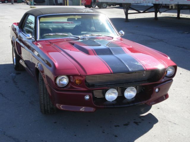 1967 maroon Ford Mustang Coupe