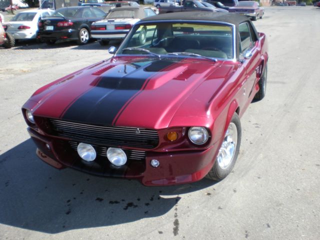 1967 maroon Ford Mustang Coupe