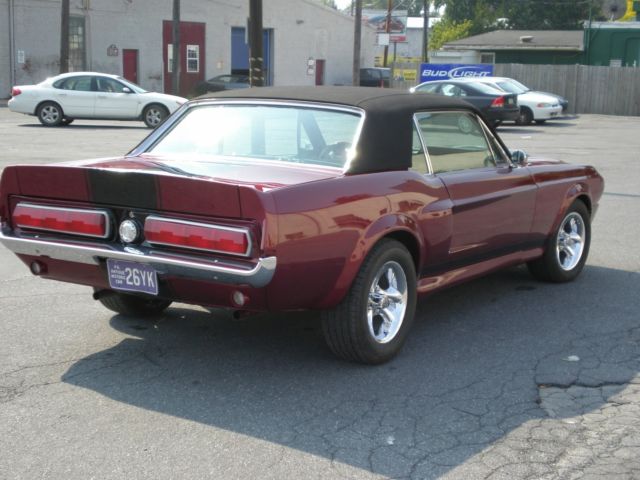 1967 maroon Ford Mustang Coupe