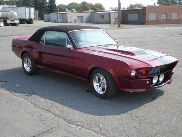 1967 maroon Ford Mustang Coupe