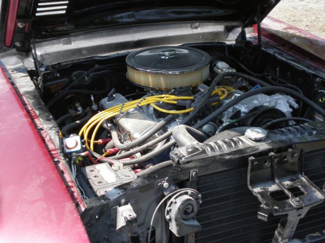 1967 maroon Ford Mustang Coupe