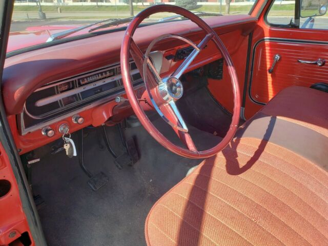 1967 red/white Ford F-100 Standard Cab Pickup