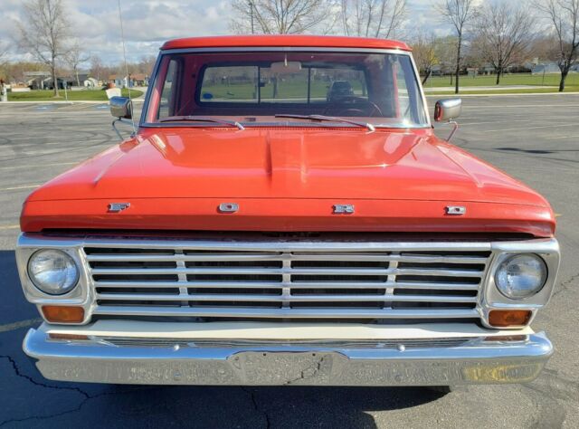 1967 red/white Ford F-100 Standard Cab Pickup