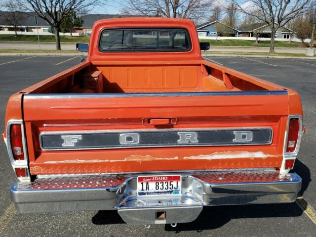 1967 red/white Ford F-100 Standard Cab Pickup