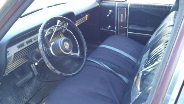 1967 white and brown Ford Galaxie Sedan